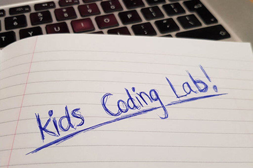 Image of kids coding written in notebook