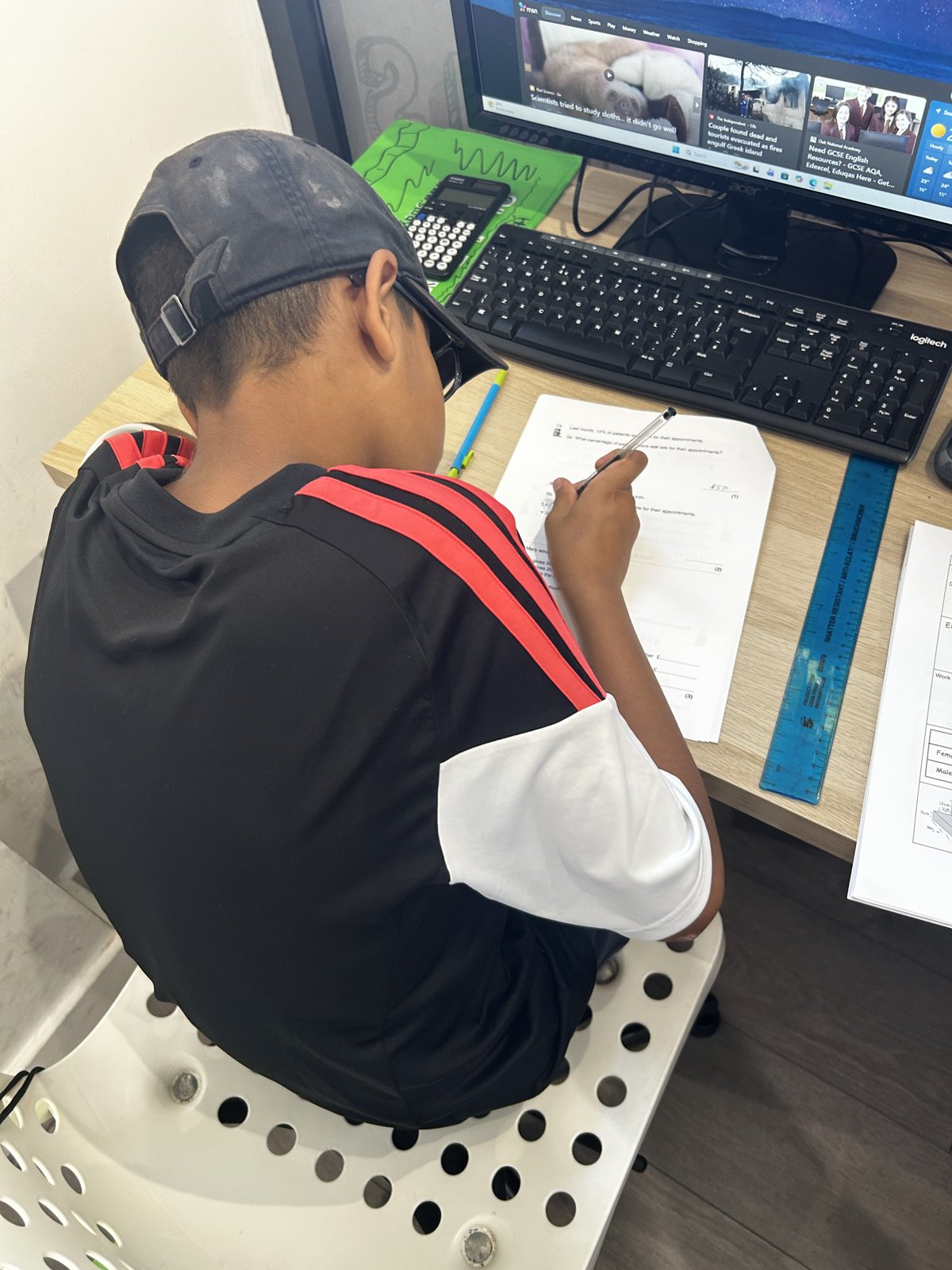 A student completing focused written work at StudyBox Croydon